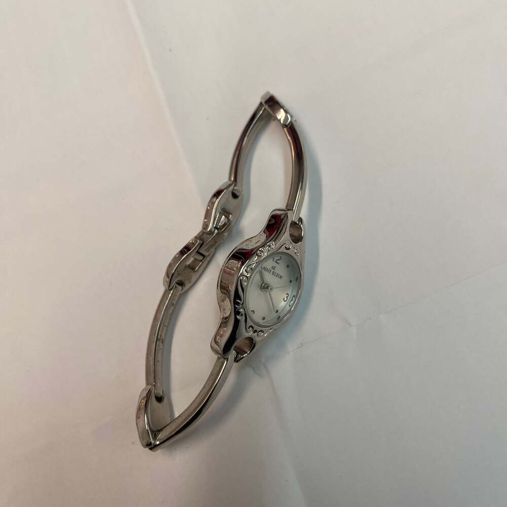 Anne Klein Women's Vintage Silver-Tone Bangle Watch with Scroll Filigree Dial